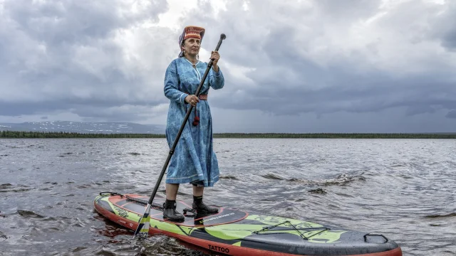 Tatiana rides for the first time in her life on a paddle. This was one of the activities offered during the Saami Summer Holiday apart from the traditional Saami games.